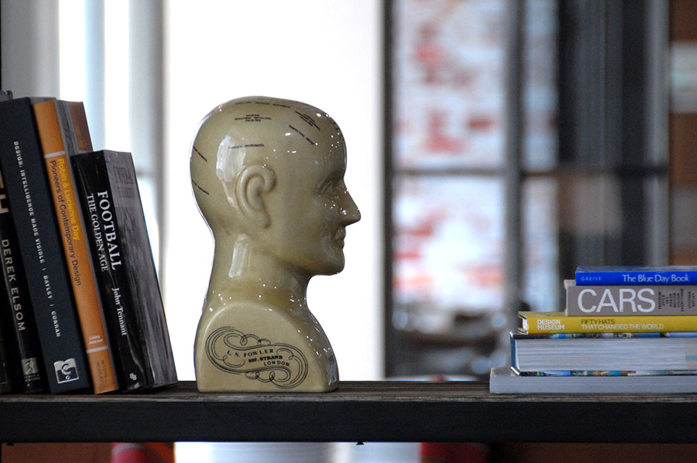 Psychology books lined up on a bookshelf