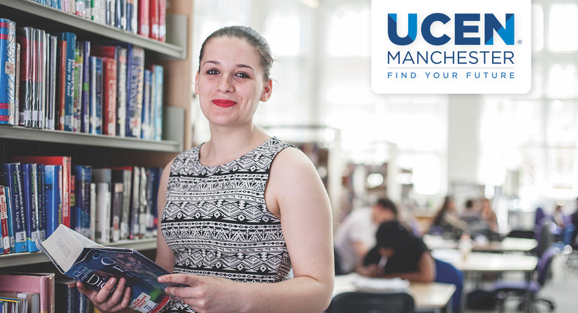 A teacher holding a book