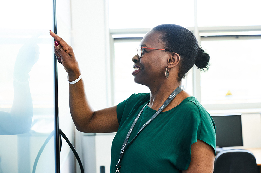An adult learner using the white board