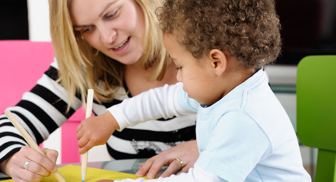 A woman and a child drawing