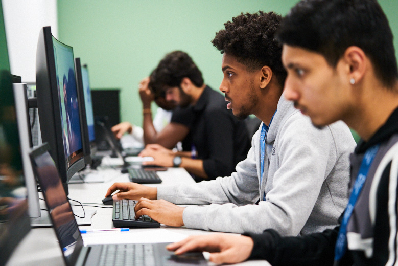 Computing students at their desks