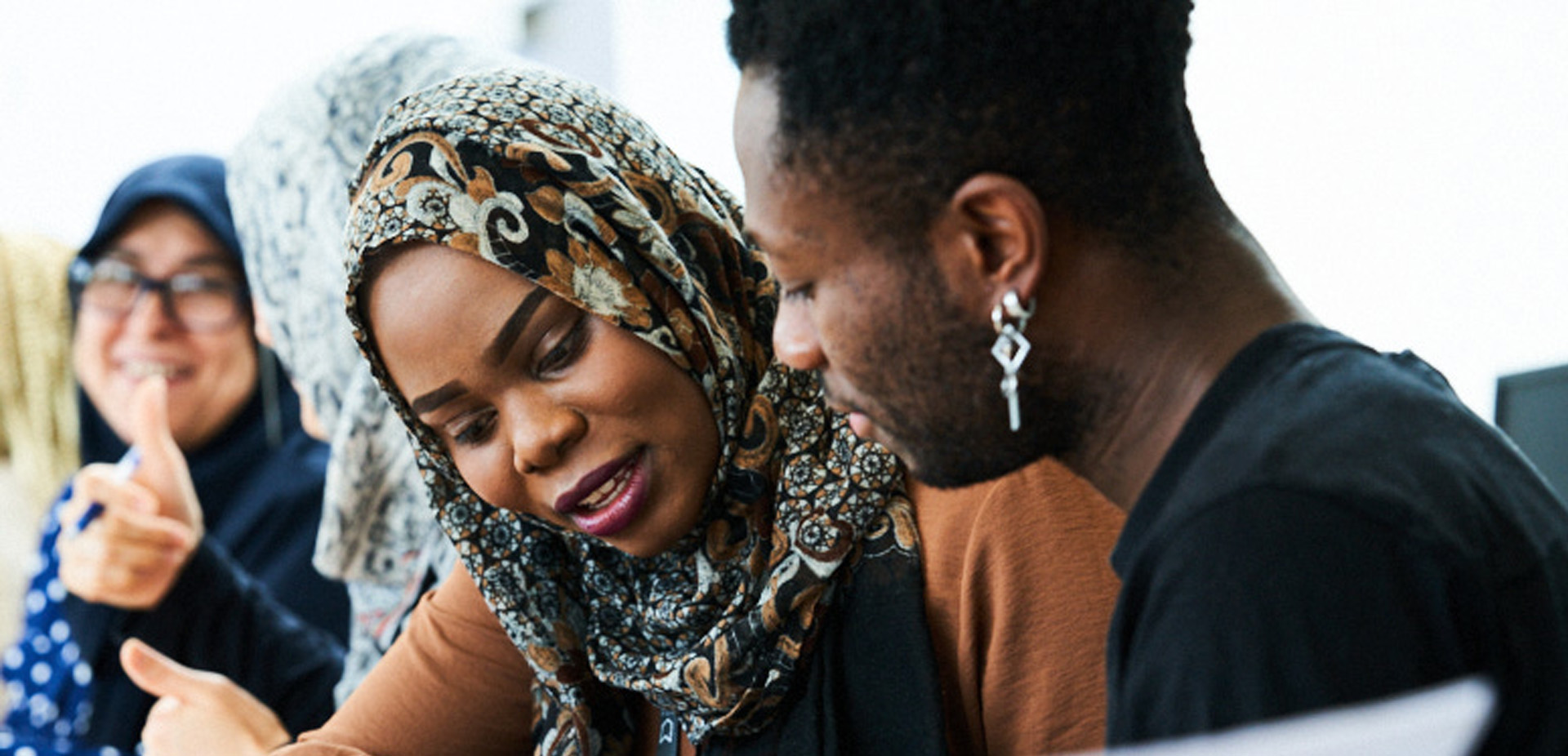 Close-up of two learners working together in a classroom setting