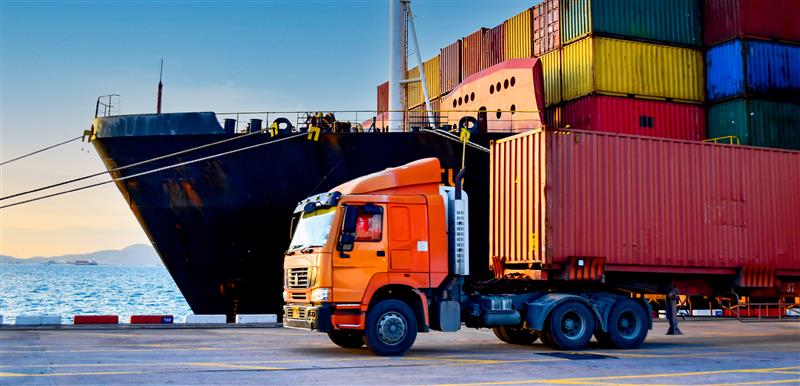 A lorry transporting goods at a ferry port