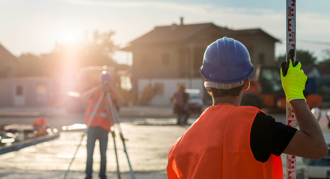 Surveyors using surveying equipment