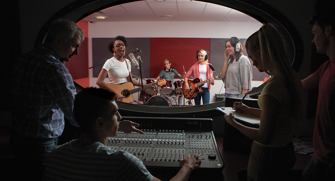 A band performing in a recording studio