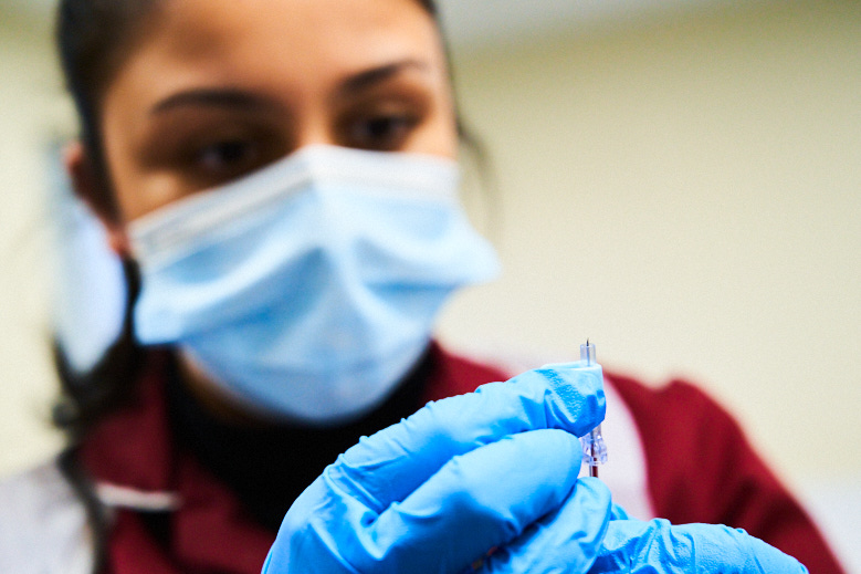 Girl preparing a needle