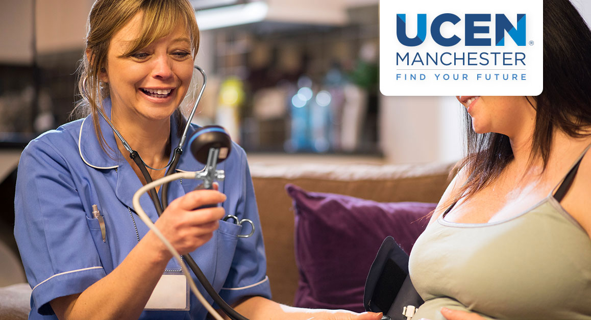 A nurse listening to a pregnant woman's stomach with a stethoscope