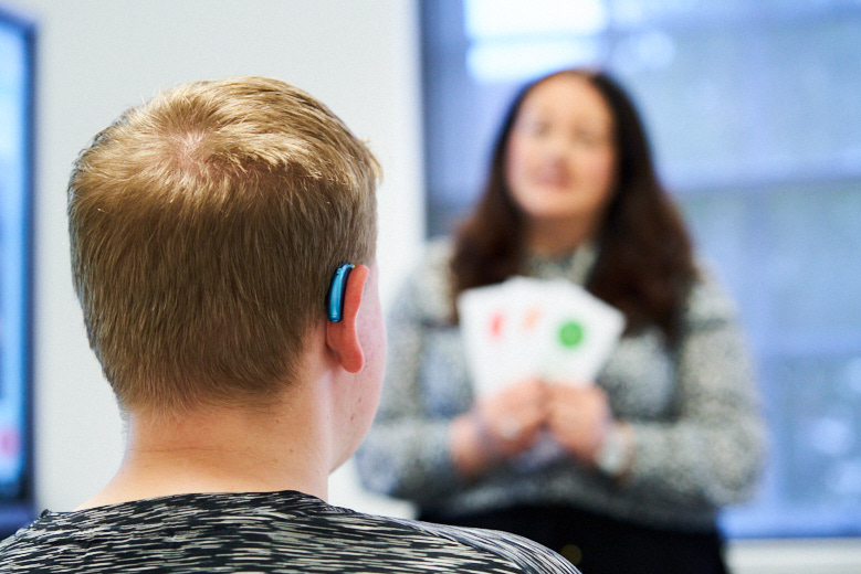 Deaf student in a classroom with teacher