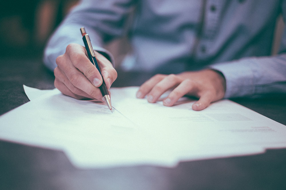 Someone filling out paperwork
