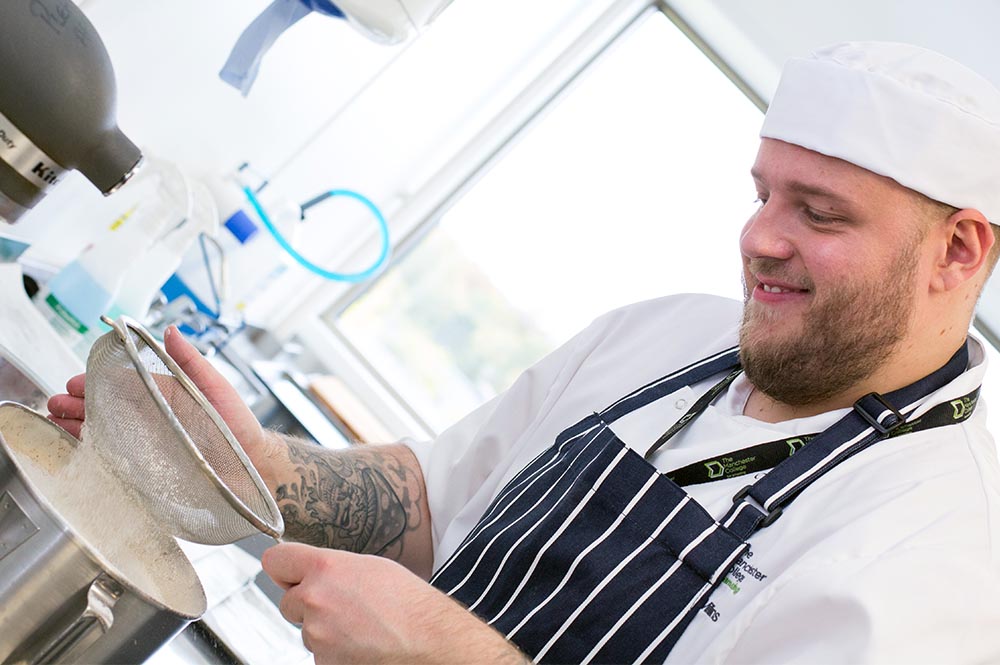 Catering student preparing food