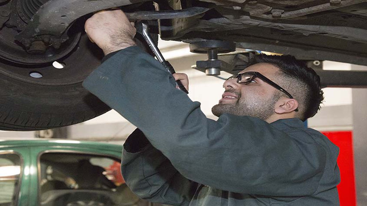 Mohammed Waseem working on a car