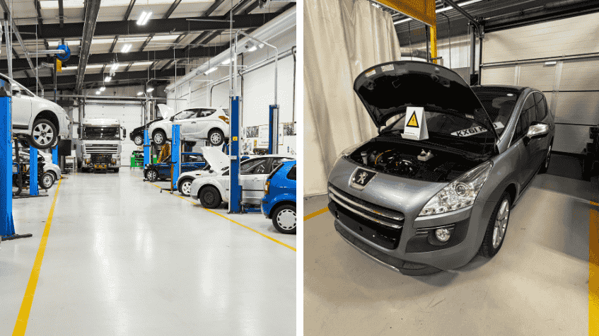Car workshop with vehicles on lifts and electric Peugeot with bonnet open.