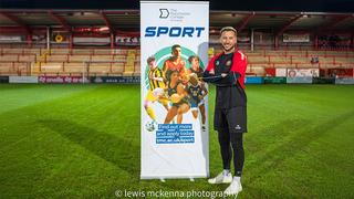 Adam Le Fondre stood on the pitch at FC United of Manchester’s Broadhurst Park Stadium.