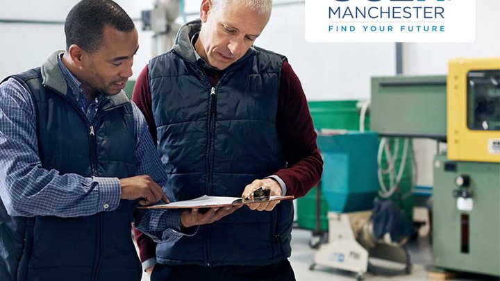 Two men discussing a document