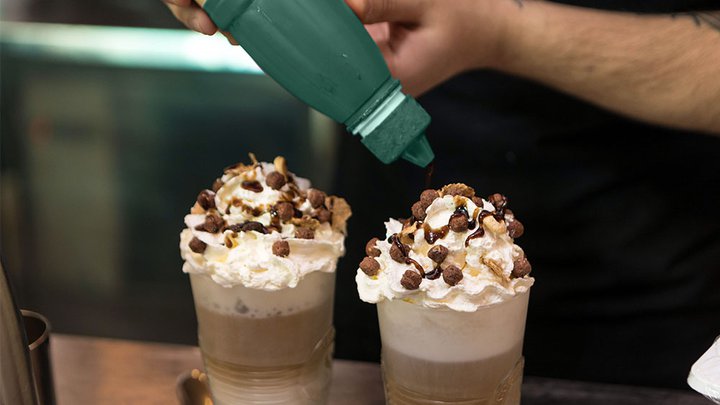 Catering staff creating a chocolate milkshake