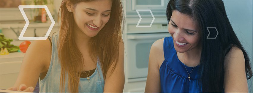 Two women looking down at a table