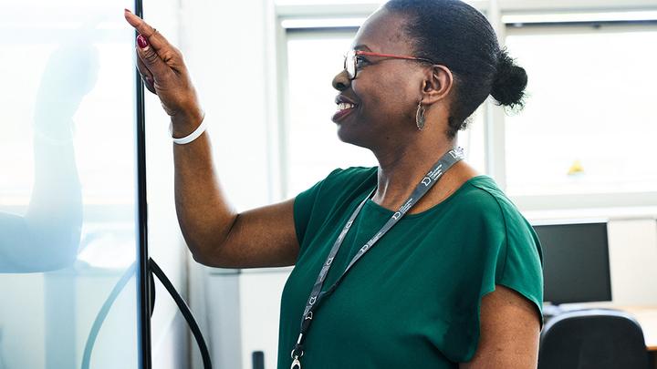 An adult learner using the white board