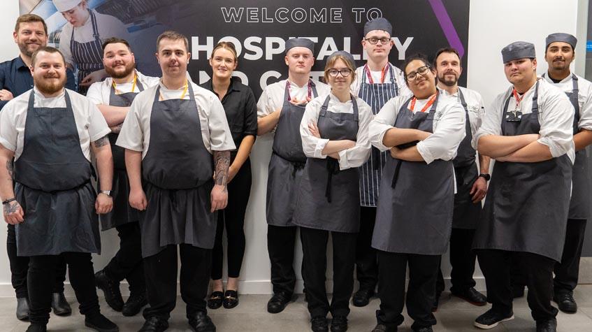 The Manchester College students with George Warwick and his team.