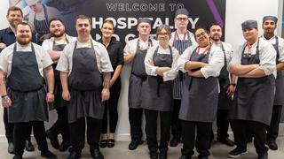 The Manchester College students with George Warwick and his team.