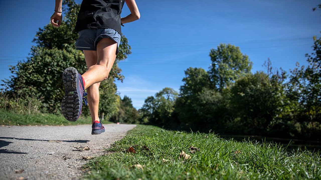 Someone jogging along a footpath