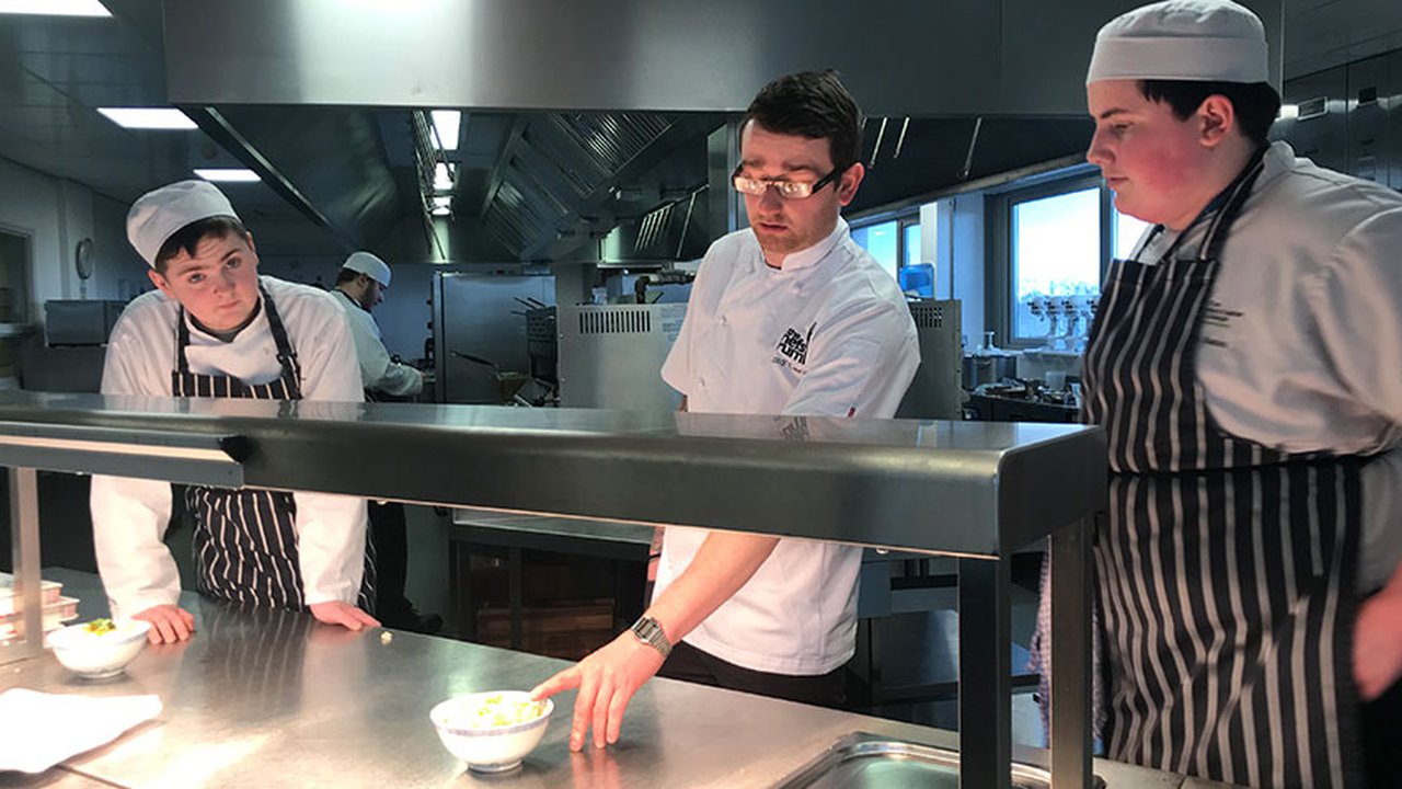 Chef Jimmy Carr and two Manchester College students