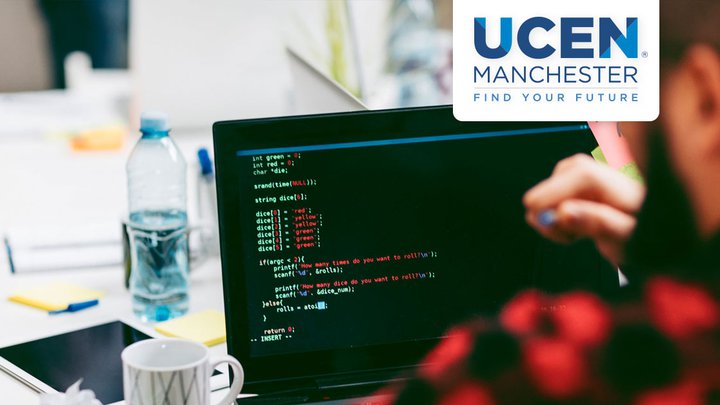 A UCEN Manchester student writing data code on a computer