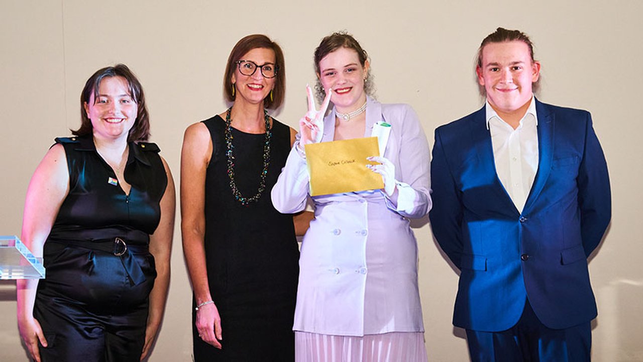 Photograph of Sophie Colbeck collecting the Student of the Year Award at The Manchester College's Student Awards.