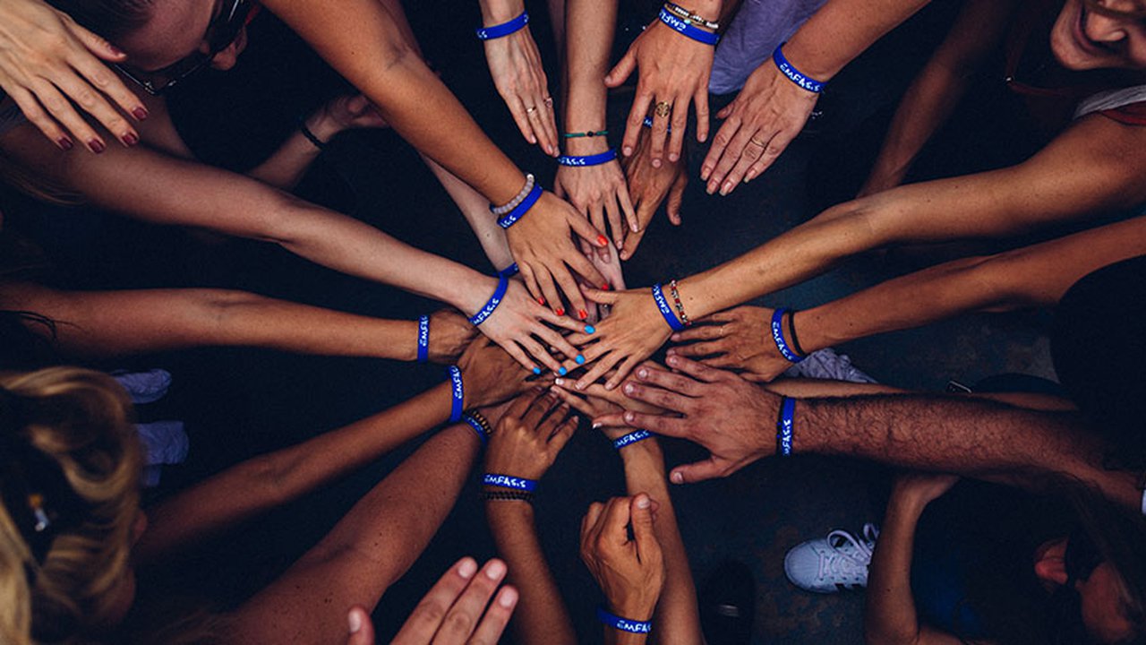 A group of hands joined together