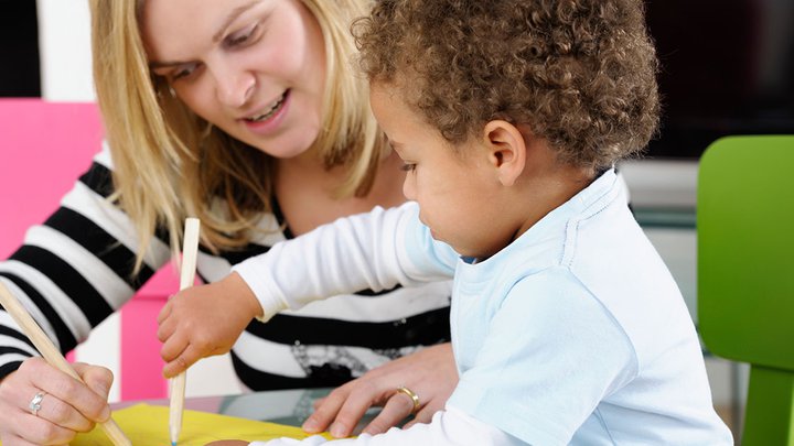 A woman and a child drawing