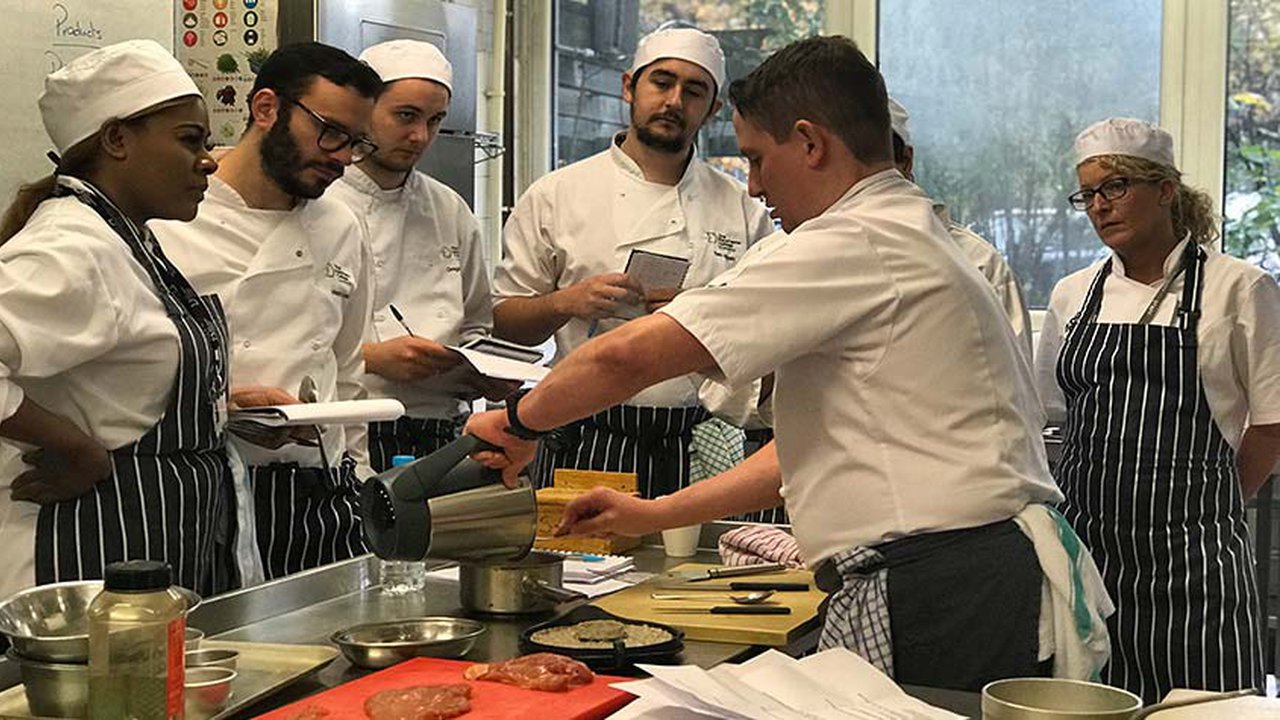 Chef Kevin Kindland demonstrating cookery skills