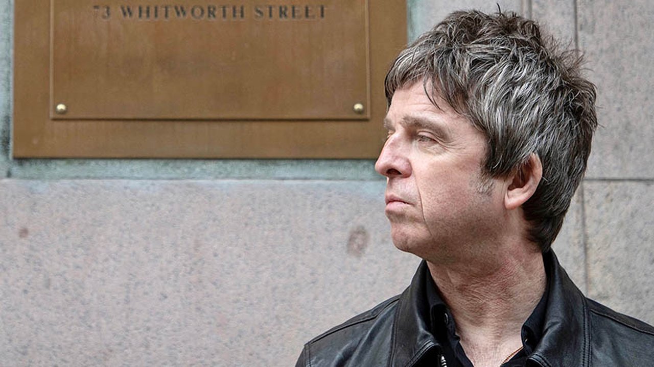 Headshot of Noel Gallagher outside India House on Whitworth Street in Manchester.