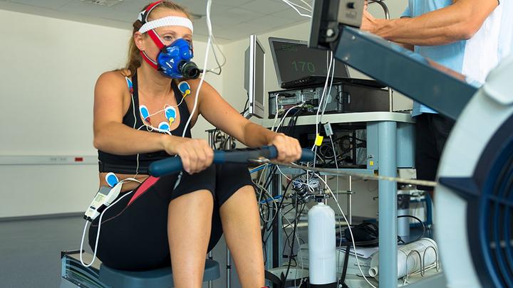 A woman hooked up to sports measurement equipment