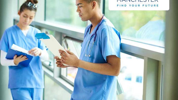 Two medical students examining results