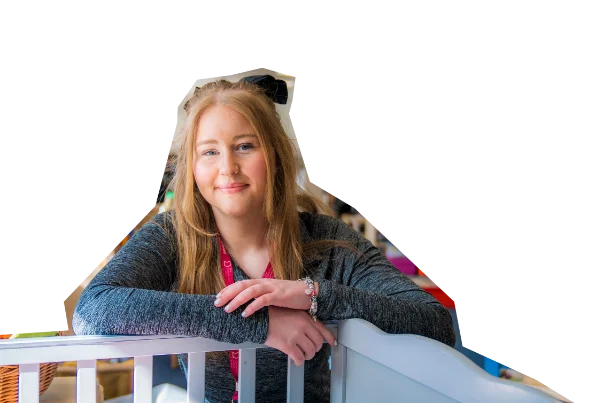 College learner leaning on a white railing, shown as a cut-out image against a pink background.