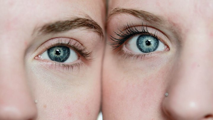 Close-up of two people's eyes and lashes