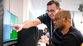 An adult learner engaging during a computing and digital course