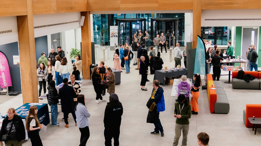 Group of people talking at The Manchester College