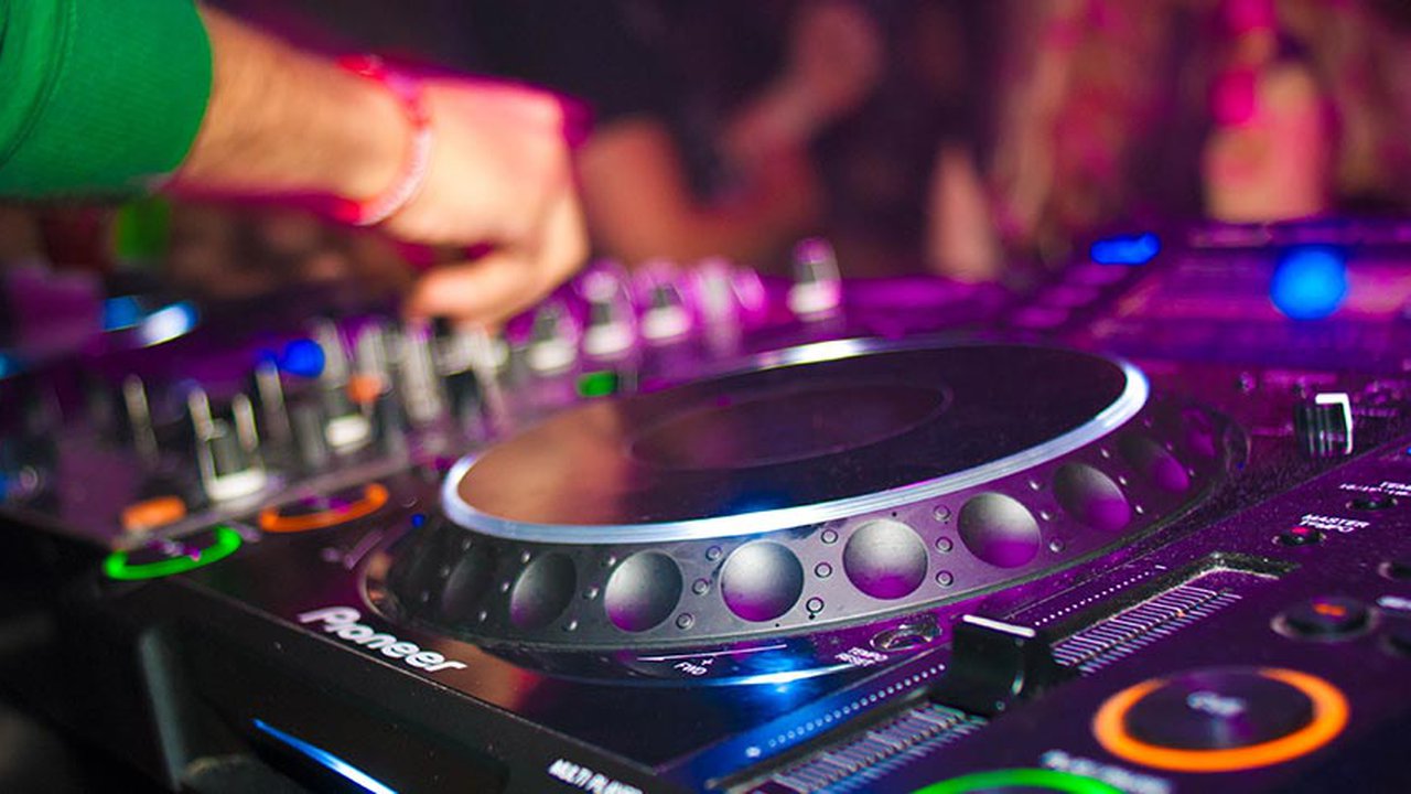 Disk Jockey at a turn table