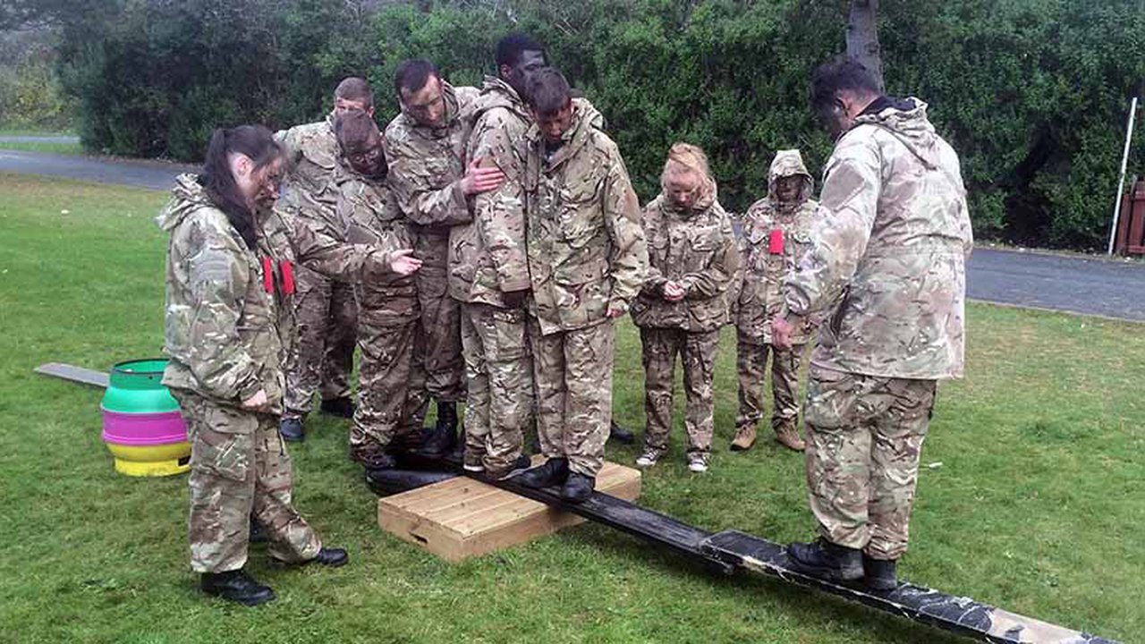 Group of students taking part in army activity