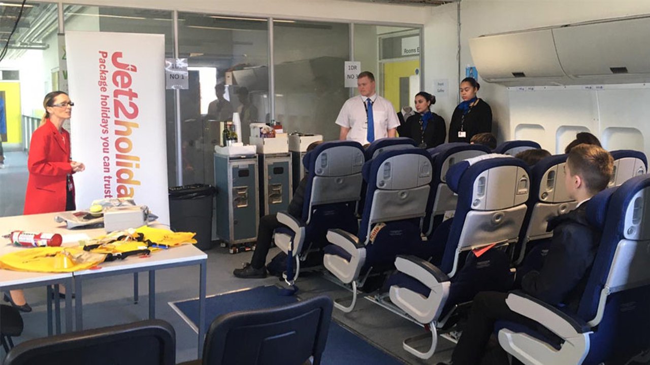 students sat in a mock airplane