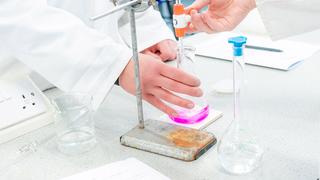 Image of a science experiment taking place in a laboratory.