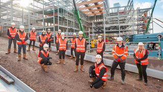 Construction students at the site of City Campus Manchester