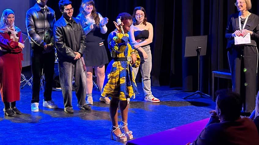 Students competing in the grand final of TMC's Got Talent 2026 on stage in the Studio Theatre at City Campus Manchester.