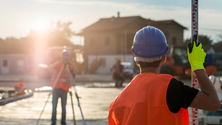 Surveyors using surveying equipment