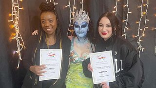 Photograph of two The Manchester College students alongside their model at the Association of Hairdressers and Therapists competition in Blackpool.