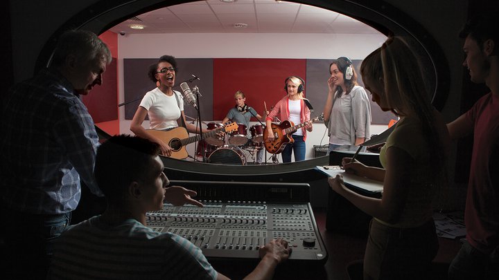 A band performing in a recording studio