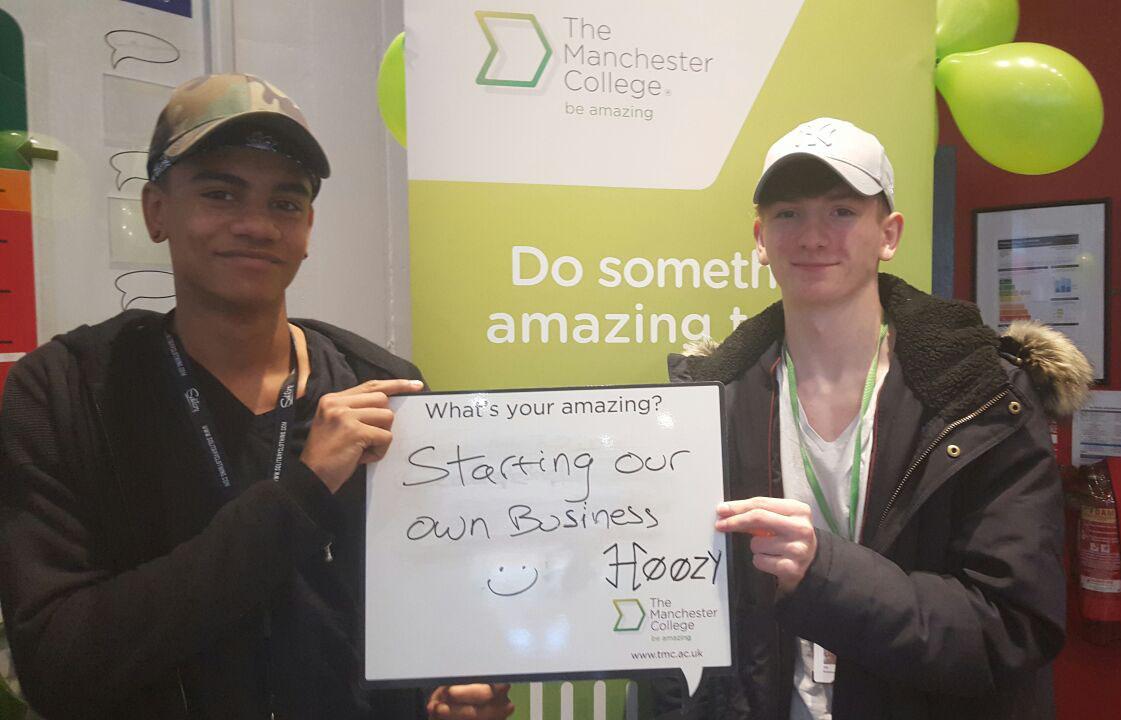 Two students holding up their 'be amazing'