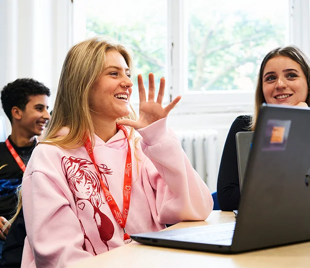 T Level students smiling and talking