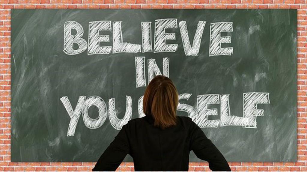 Blackboard with "Believe in yourself" written on it
