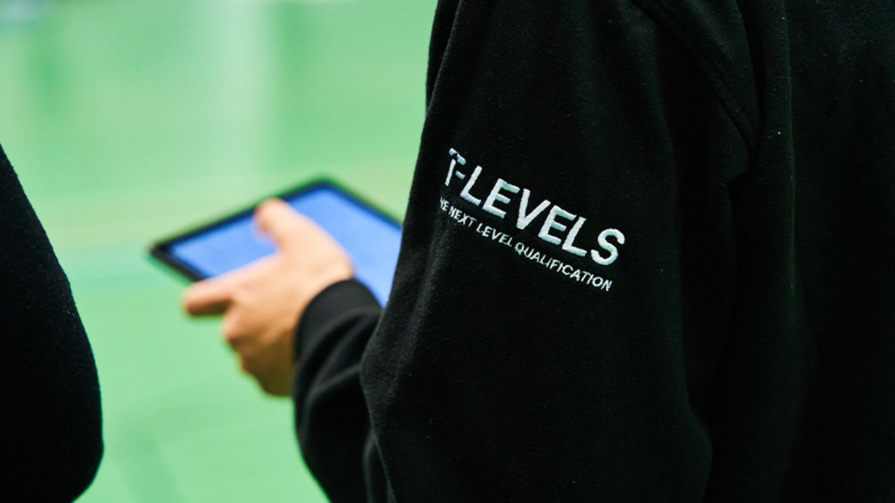 Photograph of a student at The Manchester College wearing a T Levels branded hoodie.